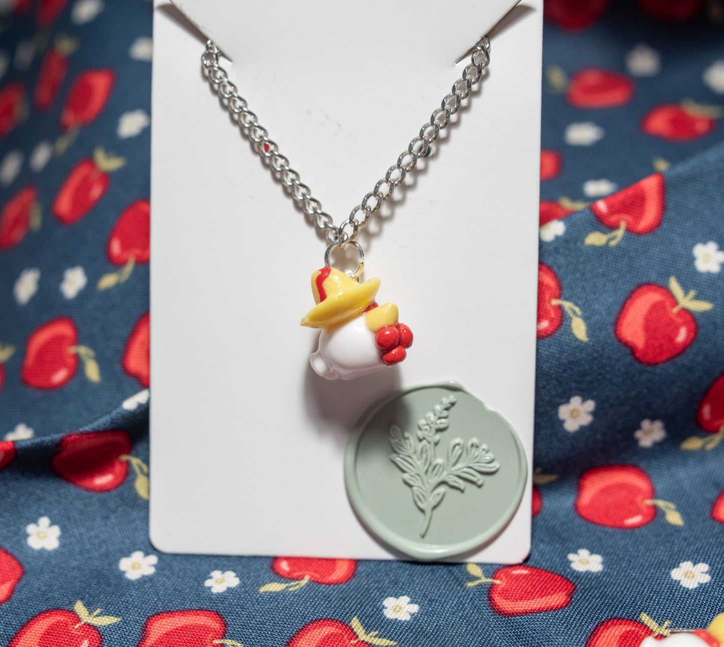 Señor Henrique chicken with sombrero necklace.