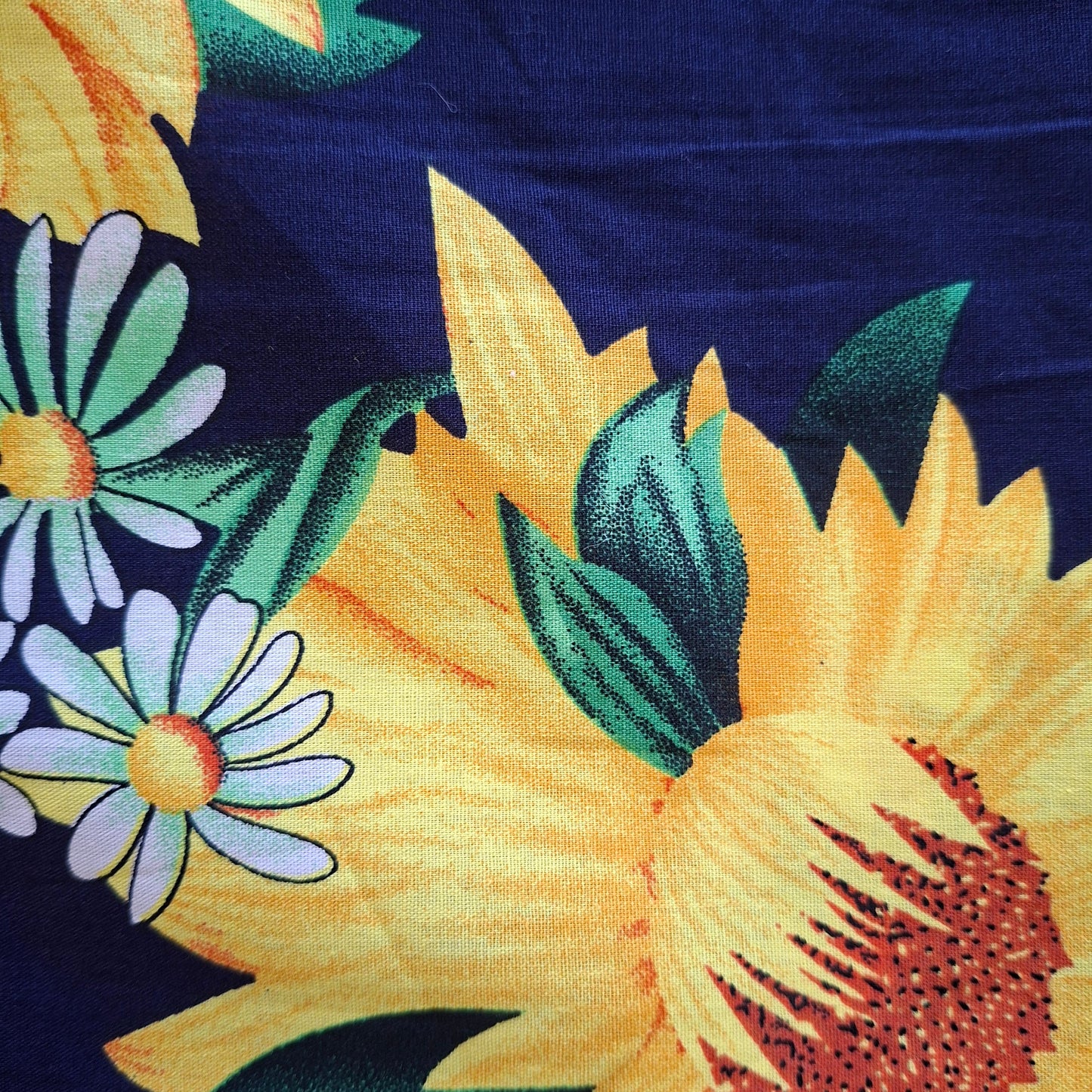 Floral pattern with sunflowers and daisies on a dark background